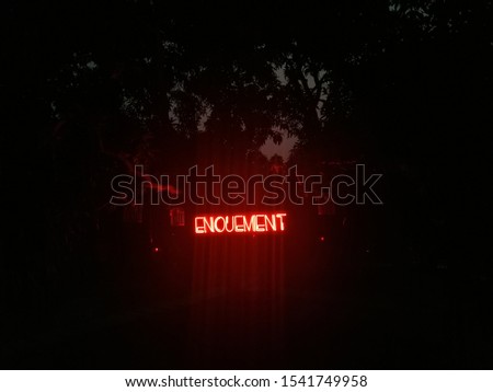 hanged and glowing word Enoument Royalty-Free Stock Photo #1541749958