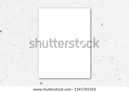 Blank white poster on white granite wall background