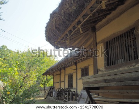 scene of traditional thatched house in Korea  