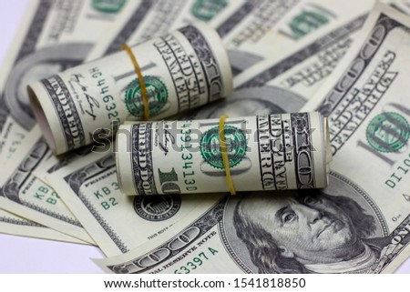 Money rolls on dollars usa background. Financial concept