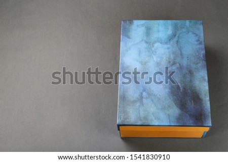 closed unbranded shoe box on a black background. place for text
 Royalty-Free Stock Photo #1541830910