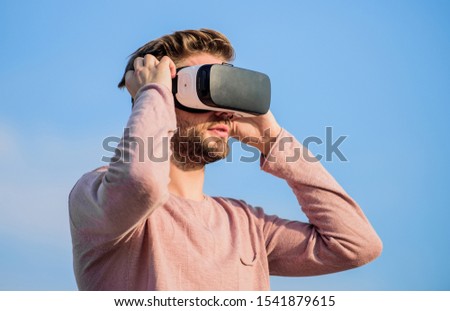 Virtual reality goggles. Augmented reality. Gamer concept. Modern technology. Digital future and innovation. Cyber space. Virtual reality. Handsome man with wireless VR glasses headset. Game online.