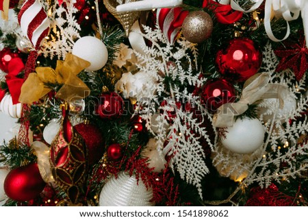 Christmas background - baubles and branch of spruce tree.