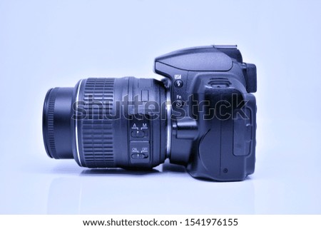 Digital photo camera isolated on bright background