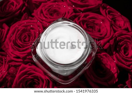 Luxe cosmetics, branding and anti-age concept - Face cream skin moisturizer and red roses flowers, luxury skincare cosmetic product on floral background as beauty brand holiday flatlay design