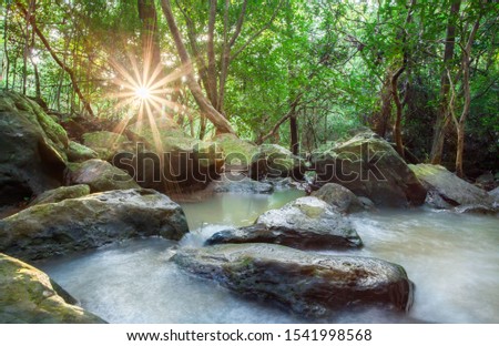 Thao To Waterfall. river background with small waterfalls in tropical forest.It flows from the rainforest mountain in the mountains of Nong Bua Lam Phu in Thailand is a beautiful landscape. 