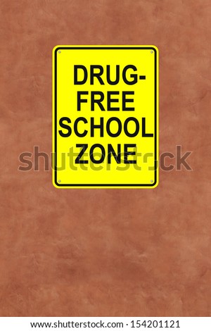 A drug-free school sign mounted on a wall 