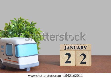 January cover design with number cube and car, Date 22.