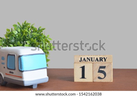 January cover design with number cube and car, Date 15.