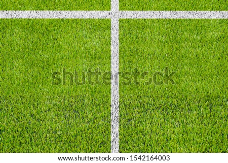 Top view of the white Line marking on the artificial green grass soccer field. 