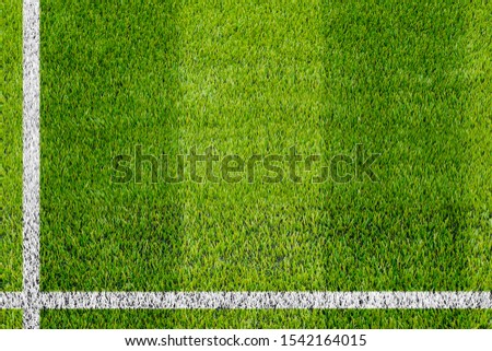 Top view of the white Line marking on the artificial green grass soccer field.  Royalty-Free Stock Photo #1542164015