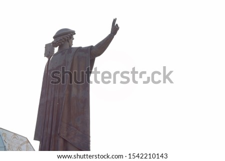 Monument of a man with a raised hand against the sky near the National Library of Belarus. Minsk, Belarus - 26 October 2019, Illustrative Editorial