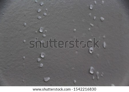 
Rain drops macro on a gray background.