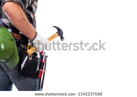 Rear view of a carpenter isolated on a white background; he wears leather work gloves, he is holding a carpenter’s hammer. Work tools industry construction and do it yourself housework. Stock photo.