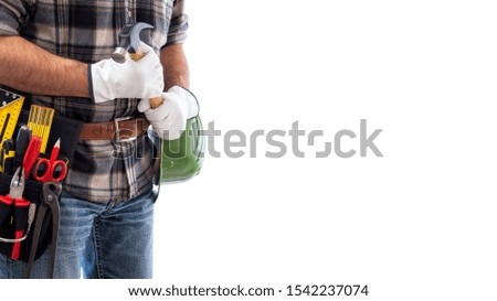 Adult craftsman carpenter isolated on white background; he wears leather work gloves, he is holding a carpenter’s hammer. Work tools industry construction and do it yourself housework. Stock photo.