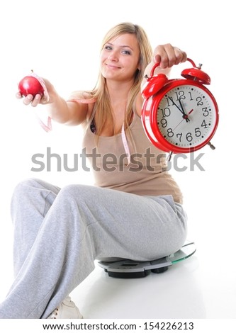 Time for diet slimming. Woman plus size large girl with clock scales apple measuring tape - weight loss concept. Isolated on a white background.