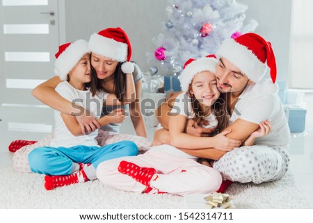 Christmas picture of beautiful family. Christmas time