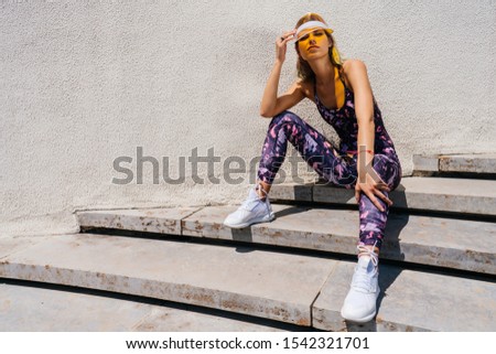 sports girl resting on the park