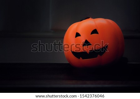 Decorative orange pumpkins on display in Halloween. Vintage style picture. Interior and Halloween day concept.