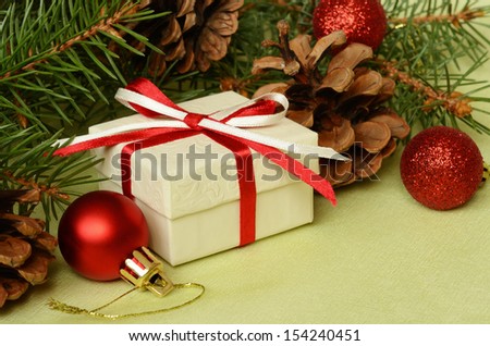 Christmas tree branch composition on green background