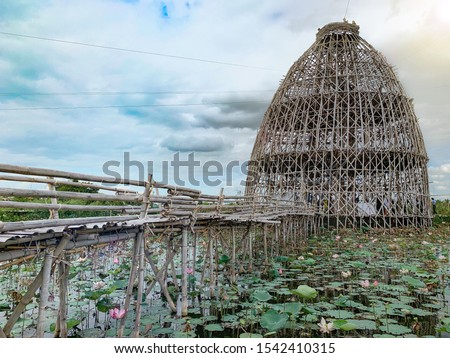 Bamboo bridge connect to bamboo tower on Lotus lake the Landmark of Suphanburi, Thailand