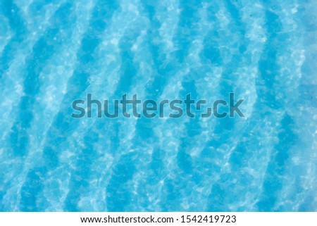 The blue sea that overlooks the sand in the top view.