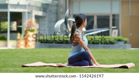 Woman do yoga at the park