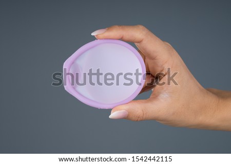 Photo Of Woman Holding Diaphragm For Contraceptive Use Royalty-Free Stock Photo #1542442115