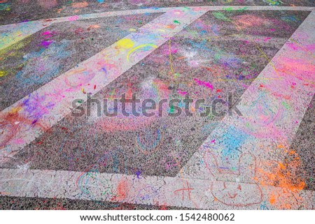  drawing with chalk on a street with colorful chalk. 