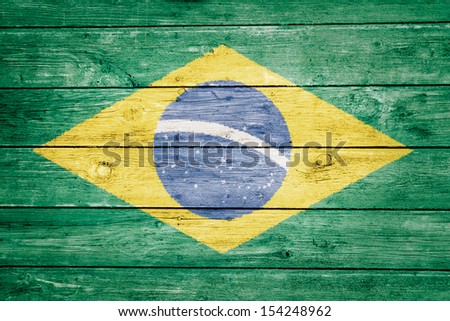 brazilian flag on wood texture background Royalty-Free Stock Photo #154248962