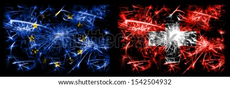 Eu, European union vs Switzerland, Swiss new year celebration sparkling fireworks flags concept background. Combination of two states flags.
