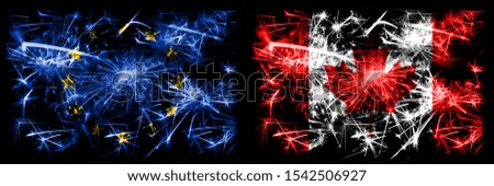 Eu, European union vs Canada, Canadian new year celebration sparkling fireworks flags concept background. Combination of two states flags.
