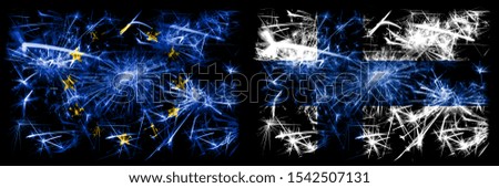 Eu, European union vs Finland, FInnish new year celebration sparkling fireworks flags concept background. Combination of two states flags.
