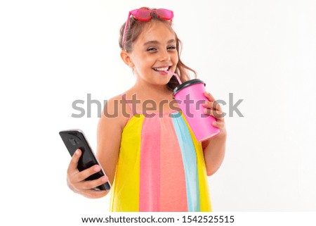 picture of a caucasian girl with sunglasses and phone drinks coffe or juice and communicate with her friends or family and smiles, isolated on white background