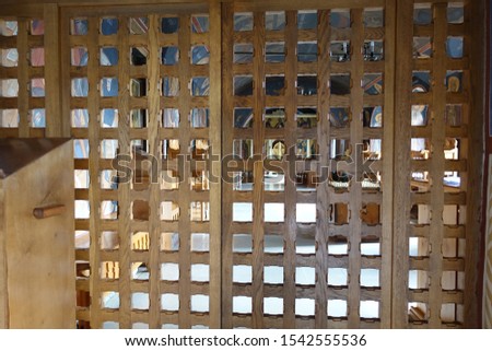 Carved curly wooden screen in the form of a lattice