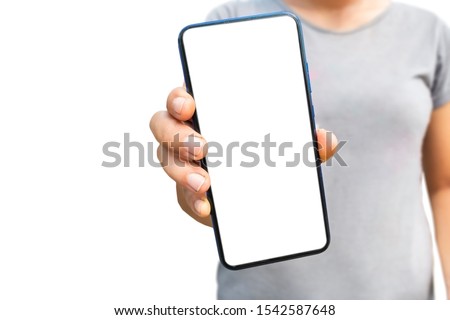 Mock up image of a business woman using and showing a smart phone with blank white desktop screen on white background.