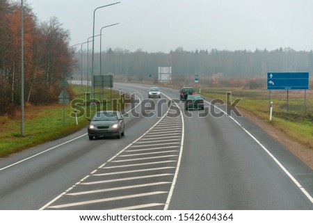 Traffic on the autumn highway