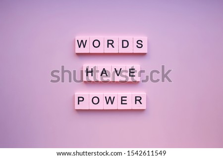 Words have power, on a pink background