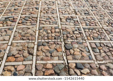 Texture of cobblestone background. Abstract background of stone pavement