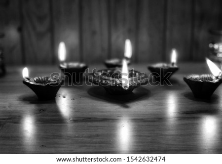 Beautiful diyas lit up during Diwali- black and white photography