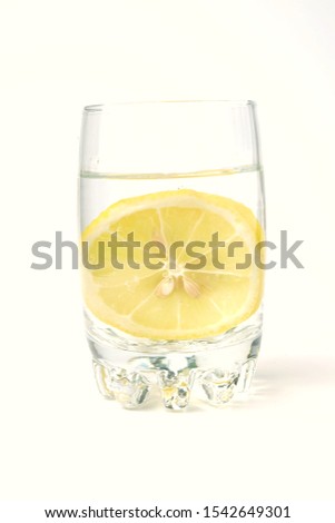 A picture of lemon water on white background. It helps to support weight loss 