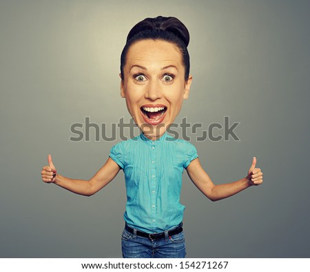 happy bighead girl showing thumbs up over grey background