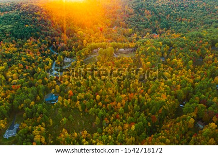 Fall foliage by Lake George at sunset. Photos are taken by drone.