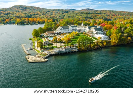 Fall foliage by Lake George at sunset. Photos are taken by drone.