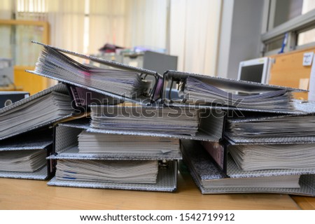 A document file placed on the desk at the office