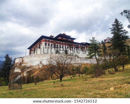 View of the Paro's massive Rinpung Dzong, a Buddhist monastery and fortress. Paro (Dzongkha) is an ancient town in the homonymous valley, with many sacred sites, temples and historical buildings.