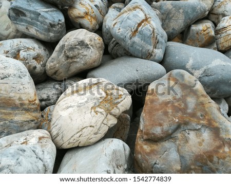 Stone texture of large pieces of marble, granite and pebbles Closeup