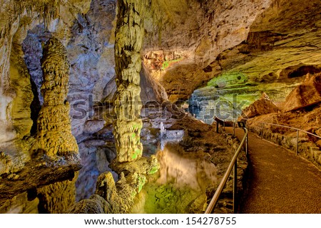 Subterranean columns in spring-fed pool, Carlsbad Caverns National Park, New Mexico. Royalty-Free Stock Photo #154278755