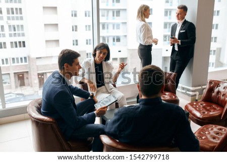 cute clever business people having meeting in the modern office building with panorama window, close up photo