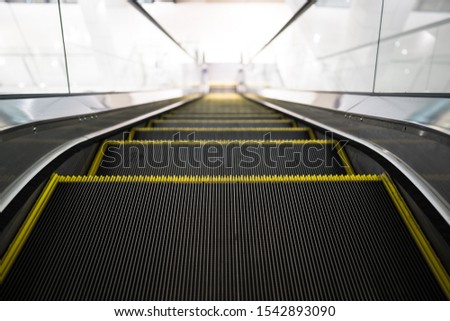 Top stair escalator down of building, technology transport people up and down of level building